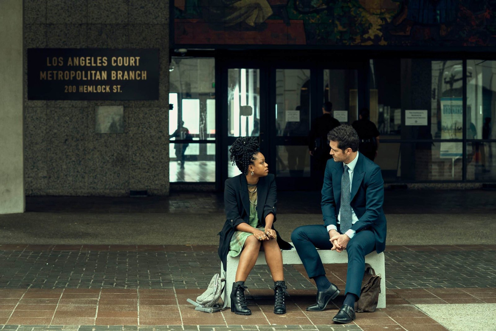 Jazz Raycole as Izzy and Manuel Garcia-Rulfo as Mickey Haller in The Lincoln Lawyer