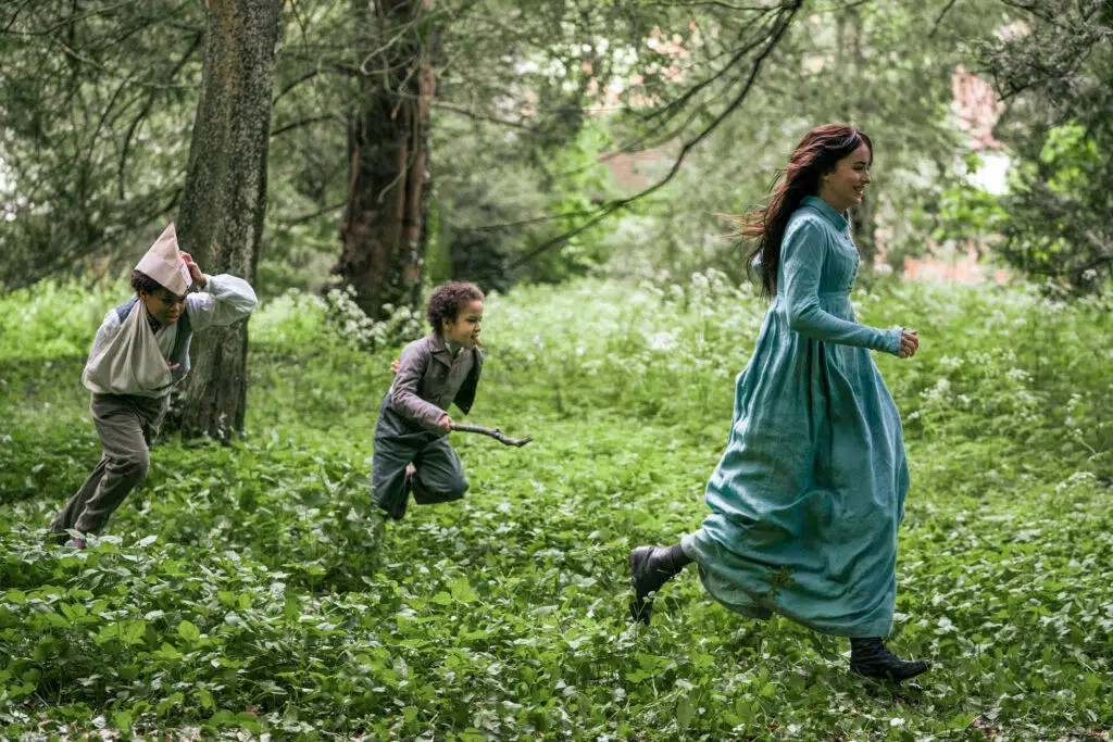Dakota Johnson, Jake Siame, and Hardy Yusuf in Persuasion (2022)